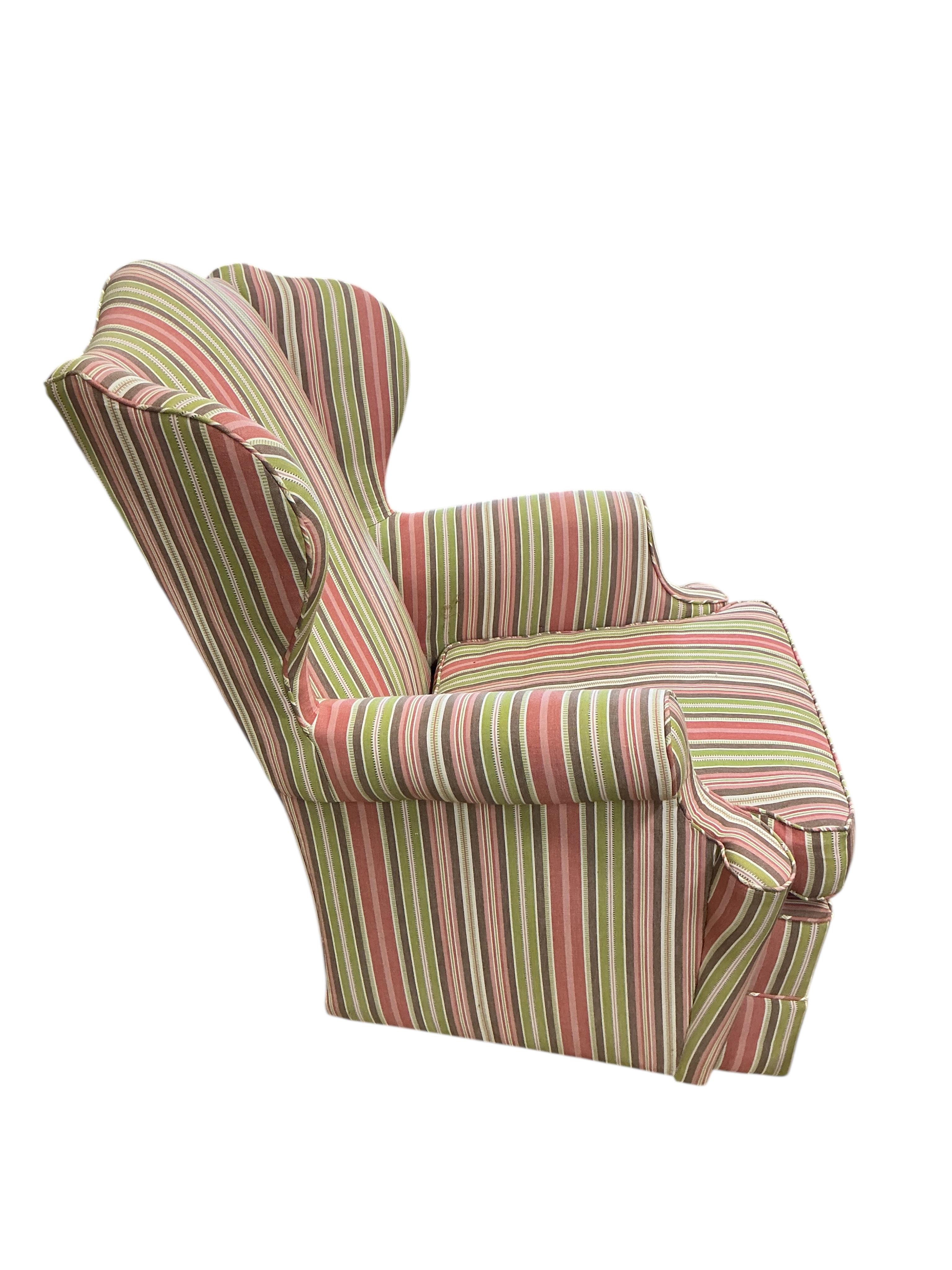 A Victorian style upholstered wing armchair, width 70cm, depth 80cm, height 94cm